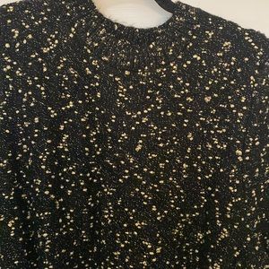 Beautiful classic black dress with gold accent. Waist tie. Long sleeve.